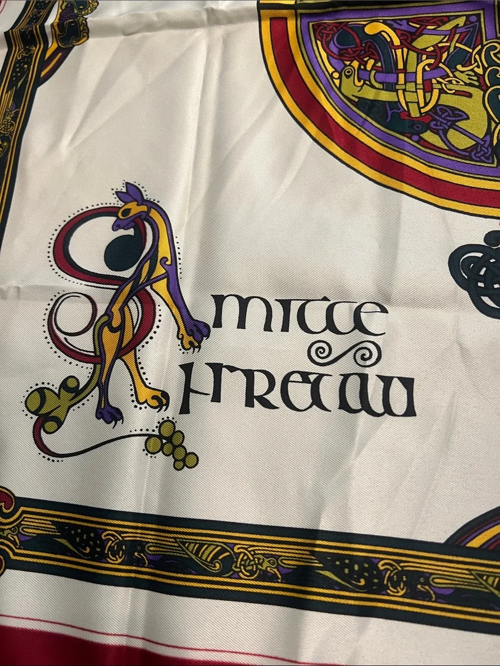 Silk-Feel Ivory Scarf with Red Trim and Multicolor Celtic Medallion